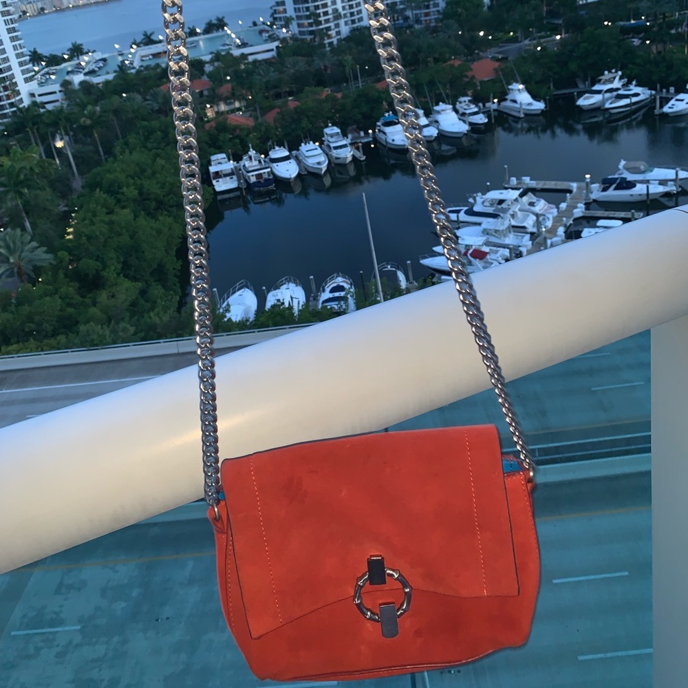 Coral little purse with blue inside.